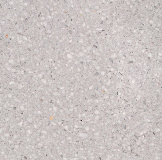 Carrelage Terrazzo Gris Brume au fond gris très clair, ponctué de fines inclusions minérales blanches et grises, pour revêtement de sol et mur.