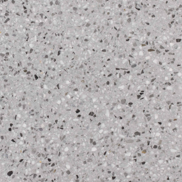 Carrelage Terrazzo Gris Minéral au fond gris moyen, ponctué de fines inclusions minérales blanches, noires et grises, pour revêtement de sol et mur.