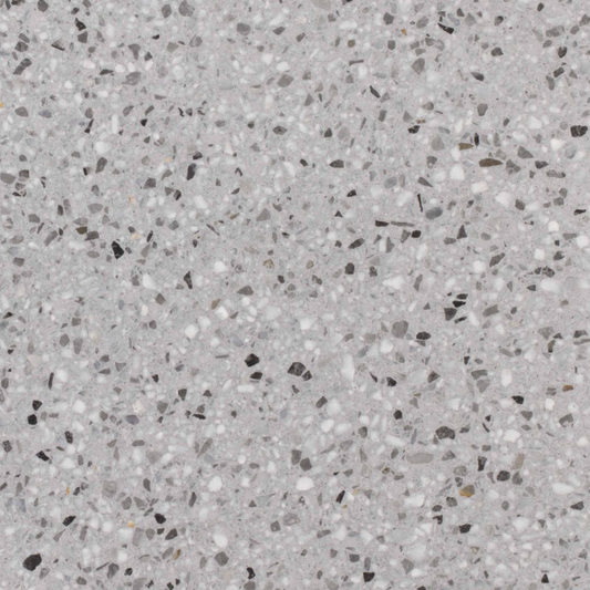Carrelage Terrazzo Gris Minéral au fond gris moyen, ponctué de fines inclusions minérales blanches, noires et grises, pour revêtement de sol et mur.