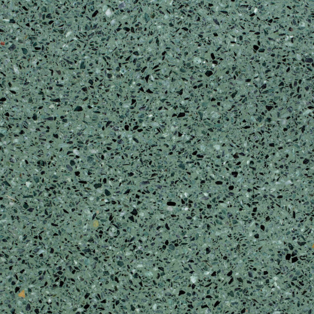 Carrelage Terrazzo Vert Forêt au fond vert naturel intense, composé de granulats de marbre noirs, blancs et gris, avec un aspect minéral contrasté.