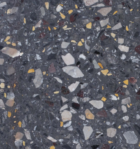 Carrelage Terrazzo Noir Mosaïque au fond noir profond, composé de fragments de marbre jaunes, blancs, gris et rouges, avec un aspect graphique et contrasté.