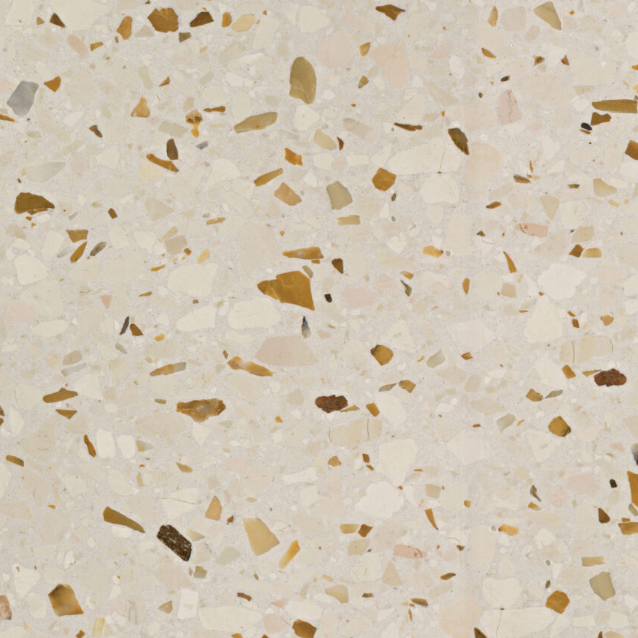 Carrelage Terrazzo Ivoire Ocré au fond clair et neutre, ponctué de granulats de marbre de taille moyenne dans des nuances chaudes de beige et d'ocre.