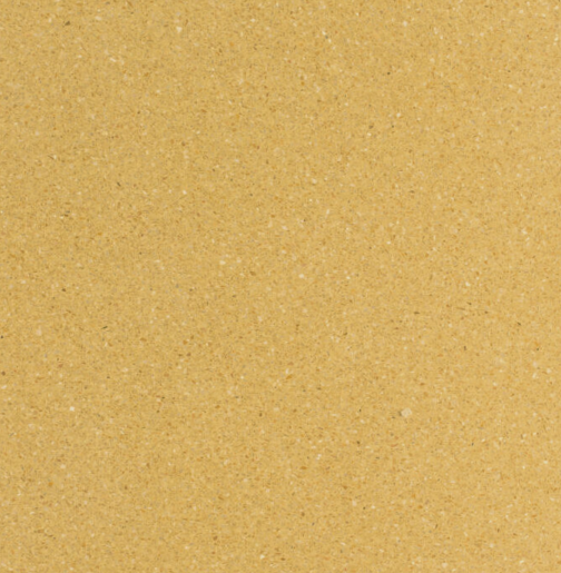 Carrelage Terrazzo Jaune Safrané au fond jaune doré chaud, composé de granulats minéraux ultrafins répartis uniformément, pour revêtement de sol et mur.