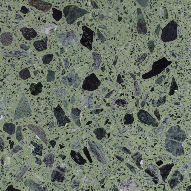Carrelage Terrazzo Mazzorbo Vert au fond vert vif, composé de grands fragments de marbre noirs et gris, avec un aspect graphique et contrasté inspiré du terrazzo vénitien.