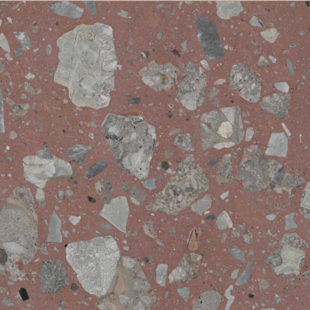 Carrelage Terrazzo Chioggia Rouge au fond rouge chaud, composé de larges fragments de marbre gris, avec un aspect graphique et contrasté.