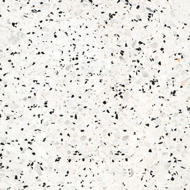 Carrelage Terrazzo Blanc Perlé au fond blanc lumineux, ponctué de fins granulés noirs et gris, pour revêtement de sol et mur.